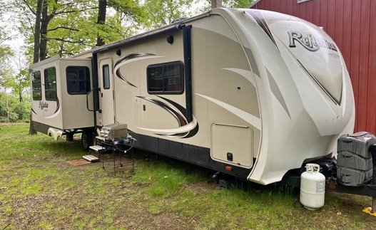 Fifth wheel rental parked at campsite